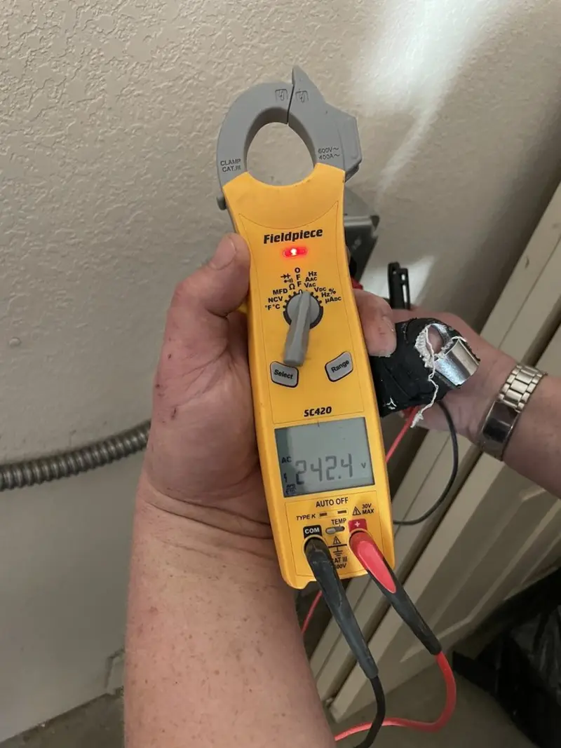 Voltage testing with clamp meter during Outlet Installation in Walled Lake